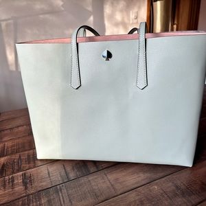 Large Kate Spade leather tote with matching zipper pouch.